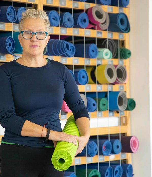 Smiling woman after a fulfilling yoga session.